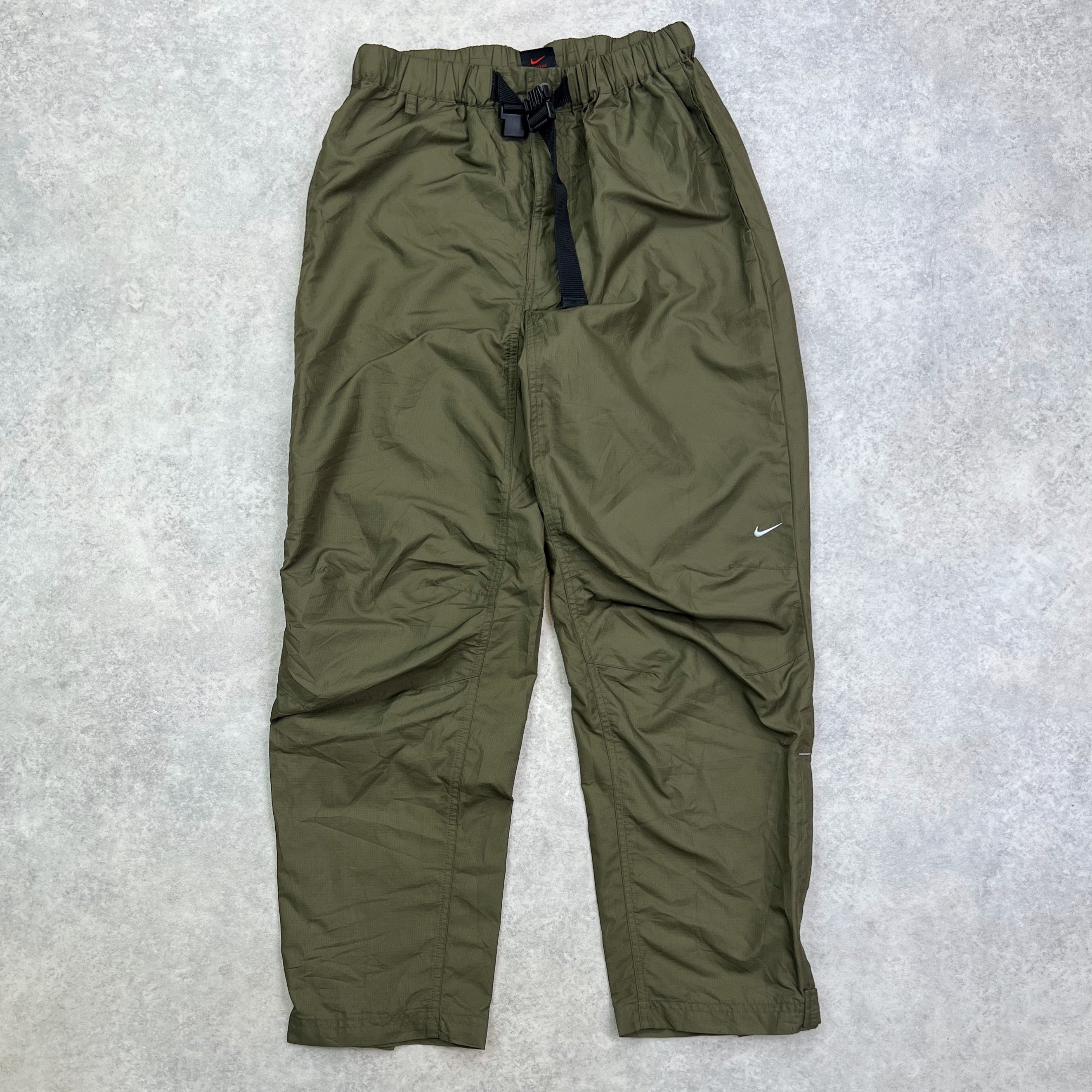 Olive green nike track on sale pants